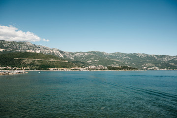 Beautiful view of the landscape of Montenegro. Sea and mountains. Buildings in the distance.