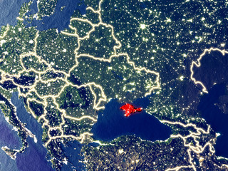 Crimea from space on Earth at night. Very fine detail of the plastic planet surface with bright city lights.