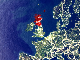 Scotland from space on Earth at night. Very fine detail of the plastic planet surface with bright city lights.