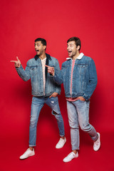 Full length of two smiling young men walking