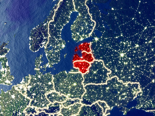 Baltic States from space on Earth at night. Very fine detail of the plastic planet surface with bright city lights.