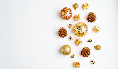 Christmas background. Flat Lay with Christmas golden deco baubles on white. Copy Space.