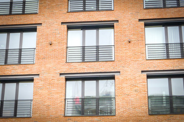 Naklejka premium Modern building exterior. Modern brick building. Red brick building. Brick wall.