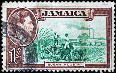 Sugar industry on vintage jamaican postage stamp - obrazy, fototapety, plakaty