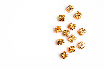 christmas or new year frame composition in gold colors on white background with empty copy space for text. holiday and celebration concept for postcard or invitation. top view