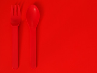 fork and knife on red background