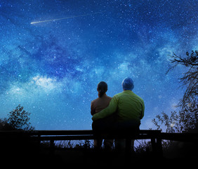 couple watching the stars in night sky