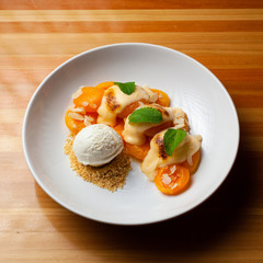 Baked apricots with sabayon sauce and ice cream