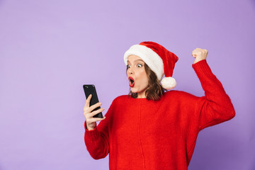 Happy young woman isolated over purple background.