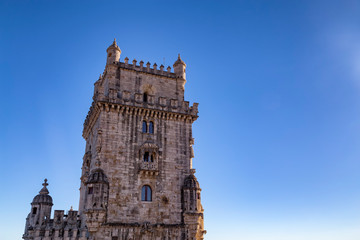 Fototapeta na wymiar Detail of Belem tower and blue sky in the summer in Lisbon, Portugal.