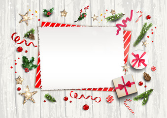 Holiday card with festive card and decorations balls, stars, snowflakes on white wood background. Christmas festive template.