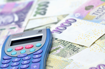 Close-up of calculator on czech crowns CZK - financial background