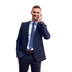 business, people and office concept - happy smiling businessman in suit