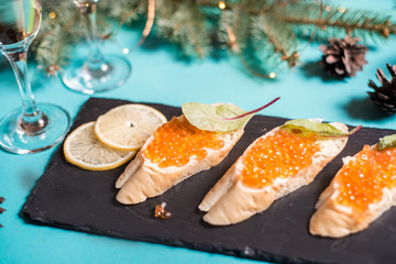 Beautifully decorated catering banquet table with different food snacks and appetizers on corporate...