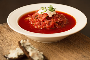 Borscht in white plate, traditional Ukrainian beet soup