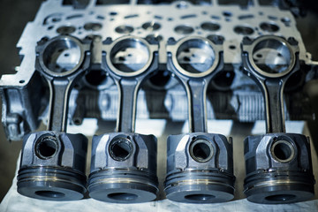 Automotive four-cylinder engine water cooling during repair.