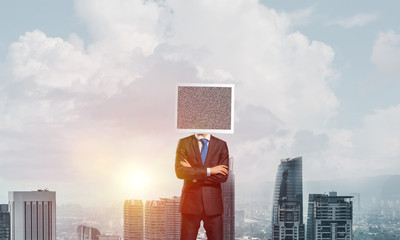 Businessman with monitor instead of head.