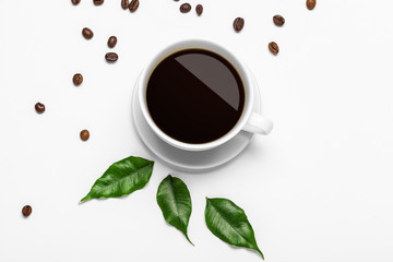 Coffee cup and beans on a white background