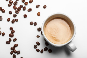 Coffee cup and beans on a white background