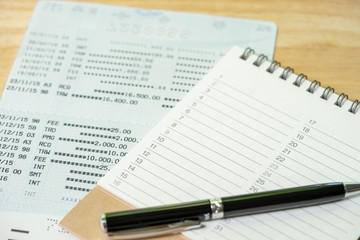 A pen is placed on a Book Rankings(list). using as background business concept and Planning concept with copy spaces and white space for your text or design.