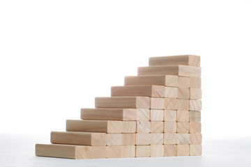 stairs build with wooden blocks on grey background