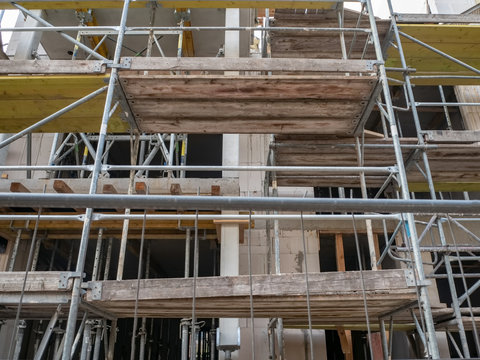 Scaffold surrounding new building