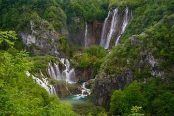 Massive waterfall among lush foliage