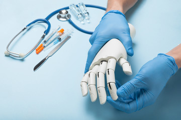 Rehabilitation of disabled in hospital. Prosthetic arm.