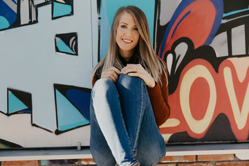 Portrait of Pretty Cute Young Blond Adult Woman Outside in Chilly Season Downtown Urban Street Art...