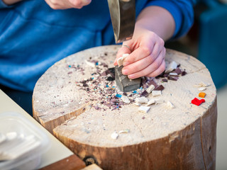 Hands Artist working on stones mosaic
