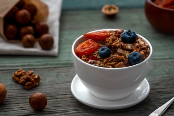 Healthy breakfast. Granola, walnut, macadamia nut and dried apricots.