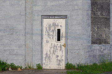 A door with peeling paint.