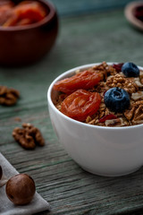 Healthy breakfast. Granola, walnut, macadamia nut and dried apricots.