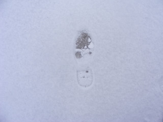 track of boot on snow close up