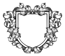 A coat of arms crest heraldic medieval knight or royal family shield. Vintage motif with filigree leaf heraldry.