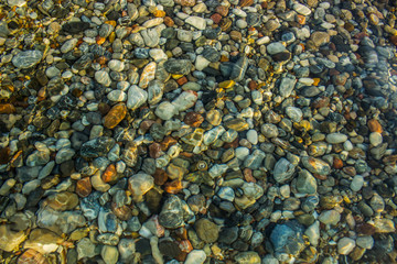 abstract unfocused fuzzy underwater colorful stones background sea bottom concept shot 