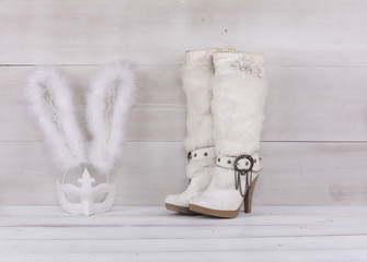 white fur boots on the white floor