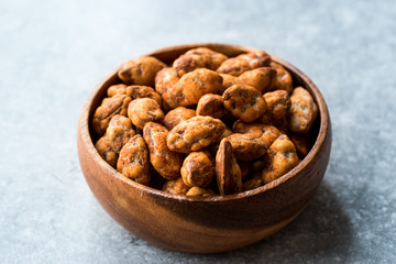 Almond Nuts with Barbeque Sauce in Wooden Bowl.