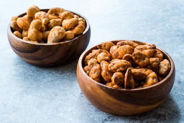 Almond Nuts with Barbeque Sauce and Spicy Cashew with Taco Spice in Wooden Bowl.