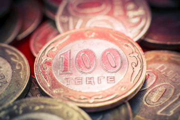 Many hundreds of tenge of coins. Kazakhstan money, close-up.
