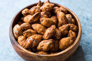 Almond Nuts with Barbeque Sauce in Wooden Bowl.