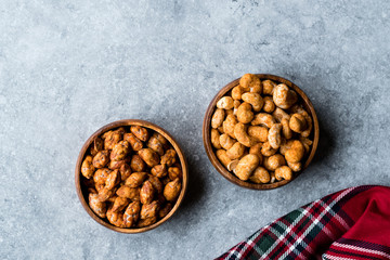 Almond Nuts with Barbeque Sauce and Spicy Cashew with Taco Spice in Wooden Bowl.