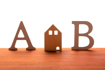 housing and life symbol on wooden board