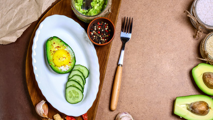 Fototapeta na wymiar bruschetta with avocado baked with egg. Fitness food. Superfoods. green fresh vegetables. copy space, top view