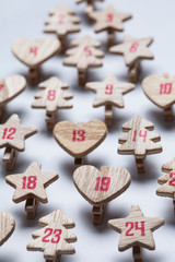 Festive Christmas advent calendar made from wooden shapes