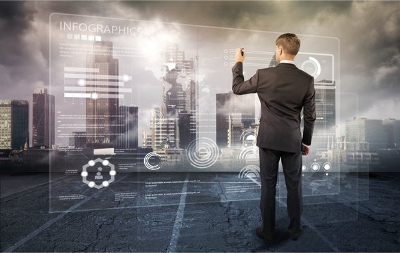 Man looking at user interface over cityscape background