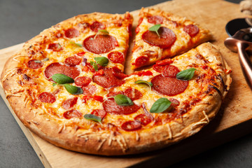 Pizza with salami and chorizo © George Dolgikh