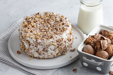 Round homemade goat cheese with walnuts and cranberries