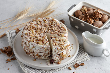 Round homemade goat cheese with walnuts and cranberries