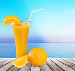 Orange juice and slices of orange on background